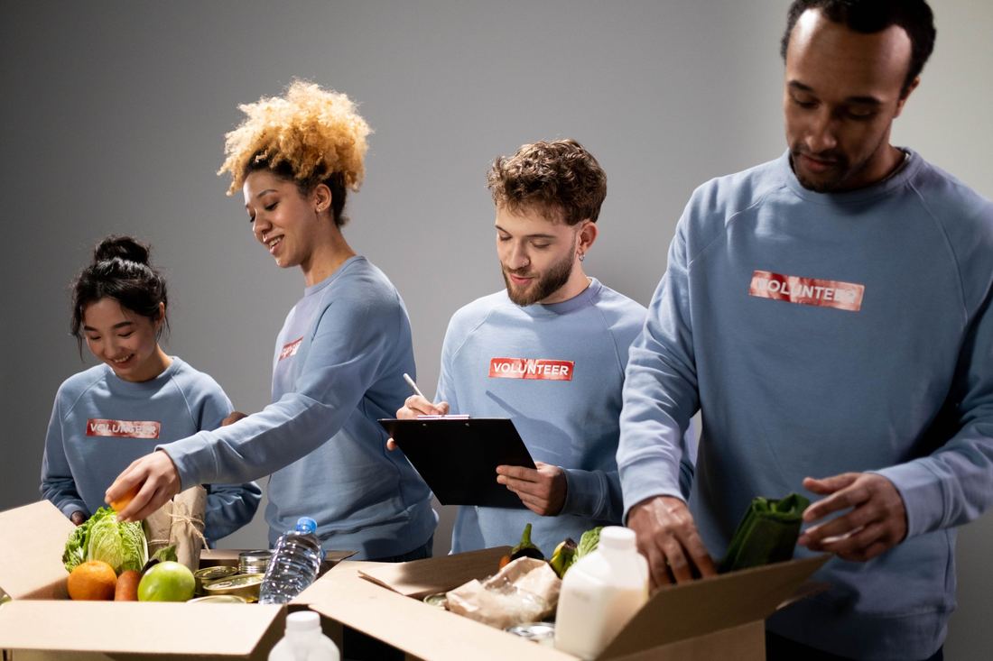 Volunteers packing donated food into boxes